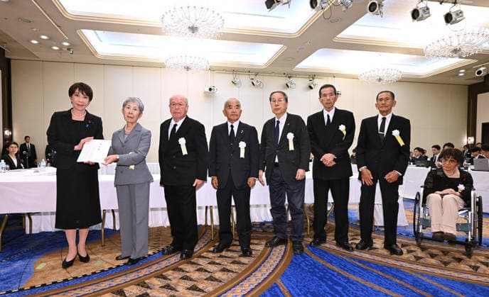 81st A-bomb anniversary in Nagasaki Japanese Prime Minister Sanae Takaichi (far L) receives paper listing a set of demands during a meeting with representatives of groups of atomic bomb survivors in Nagasaki on Aug. 9, 2026, after attending a memorial ceremony marking the 81st anniversary of the U.S. atomic bombing of the southwestern Japan city in World War II. (Pool photo)  A14AA0005625423P