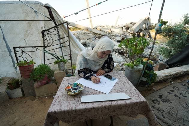 August 9, 2026, Gaza City, Palestine, State of: GAZA Gaza City, GAZA STRIP †AUGUST 9, 2026: Palestinian artist Nadia Abu Issa creates charcoal drawings depicting the hardships experienced by civilians during the war in Gaza, including shortages of food and water and life under continued displacement and insecurity. Living near an area affected by ongoing military activity, Abu Issa says her artwork aims to document the daily realities faced by Palestinians and preserve their experiences through art. Among her recent works is a portrait of Turkish President Recep Tayyip ErdoÄŸan, which she says she created as a gesture of appreciation for Turkeyâ€⠢s support for Palestinians. Gaza City Palestine, State of - ZUMAq101 20260809_zna_q101_148 Copyright: xRamzixAbuxAmerx