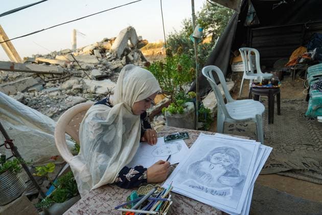 August 9, 2026, Gaza City, Palestine, State of: GAZA Gaza City, GAZA STRIP †AUGUST 9, 2026: Palestinian artist Nadia Abu Issa creates charcoal drawings depicting the hardships experienced by civilians during the war in Gaza, including shortages of food and water and life under continued displacement and insecurity. Living near an area affected by ongoing military activity, Abu Issa says her artwork aims to document the daily realities faced by Palestinians and preserve their experiences through art. Among her recent works is a portrait of Turkish President Recep Tayyip ErdoÄŸan, which she says she created as a gesture of appreciation for Turkeyâ€⠢s support for Palestinians. Gaza City Palestine, State of - ZUMAq101 20260809_zna_q101_136 Copyright: xRamzixAbuxAmerx