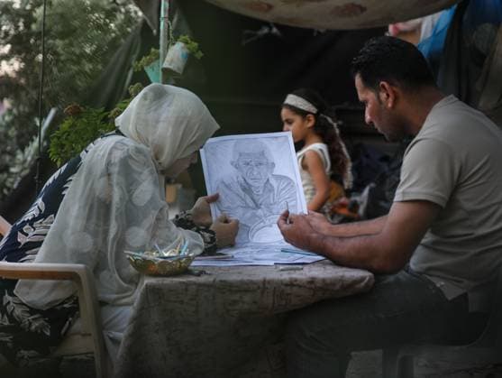 August 10, 2026, Gaza City, Palestine, State of: GAZA Gaza City, GAZA STRIP †AUGUST 9, 2026: Palestinian artist Nadia Abu Issa creates charcoal drawings depicting the hardships experienced by civilians during the war in Gaza, including shortages of food and water and life under continued displacement and insecurity. Living near an area affected by ongoing military activity, Abu Issa says her artwork aims to document the daily realities faced by Palestinians and preserve their experiences through art. Among her recent works is a portrait of Turkish President Recep Tayyip ErdoÄŸan, which she says she created as a gesture of appreciation for Turkeyâ€⠢s support for Palestinians. Gaza City Palestine, State of - ZUMAq101 20260810_zna_q101_003 Copyright: xRamzixAbuxAmerx