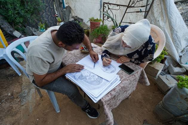 August 9, 2026, Gaza City, Palestine, State of: GAZA Gaza City, GAZA STRIP †AUGUST 9, 2026: Palestinian artist Nadia Abu Issa creates charcoal drawings depicting the hardships experienced by civilians during the war in Gaza, including shortages of food and water and life under continued displacement and insecurity. Living near an area affected by ongoing military activity, Abu Issa says her artwork aims to document the daily realities faced by Palestinians and preserve their experiences through art. Among her recent works is a portrait of Turkish President Recep Tayyip ErdoÄŸan, which she says she created as a gesture of appreciation for Turkeyâ€⠢s support for Palestinians. Gaza City Palestine, State of - ZUMAq101 20260809_zna_q101_143 Copyright: xRamzixAbuxAmerx