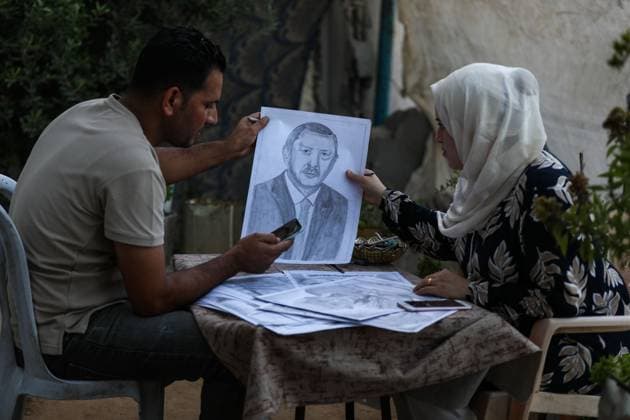 August 10, 2026, Gaza City, Palestine, State of: GAZA Gaza City, GAZA STRIP †AUGUST 9, 2026: Palestinian artist Nadia Abu Issa creates charcoal drawings depicting the hardships experienced by civilians during the war in Gaza, including shortages of food and water and life under continued displacement and insecurity. Living near an area affected by ongoing military activity, Abu Issa says her artwork aims to document the daily realities faced by Palestinians and preserve their experiences through art. Among her recent works is a portrait of Turkish President Recep Tayyip ErdoÄŸan, which she says she created as a gesture of appreciation for Turkeyâ€⠢s support for Palestinians. Gaza City Palestine, State of - ZUMAq101 20260810_zna_q101_005 Copyright: xRamzixAbuxAmerx