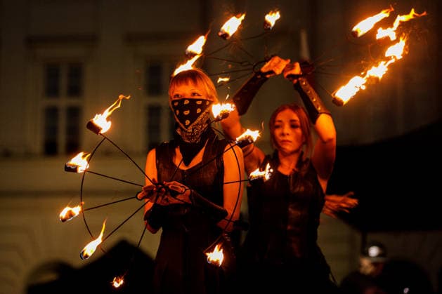 August 9, 2026, Warsaw, Poland: A flare is seen near the Nicolaus Copernicus Monument during an evening rally marking the sixth anniversary of the August 2020 presidential election in Belarus. An evening gathering marking the sixth anniversary of the August 2020 presidential election in Belarus was held near the Nicolaus Copernicus Monument in central Warsaw, bringing together leaders of Belarusian democratic forces, public figures and activists, as well as several hundred participants. Warsaw Poland - ZUMAs197 20260809_aaa_s197_110 Copyright: xVolhaxShukailax