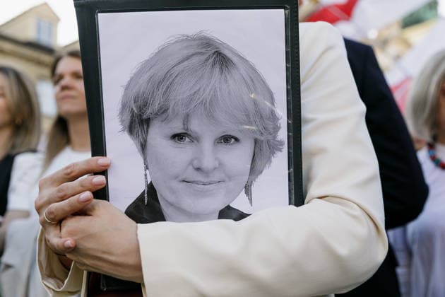 August 9, 2026, Warsaw, Poland: A portrait of TUT.BY CEO Liudmila Chekina is seen on a folder held by Belarusian democratic leader Sviatlana Tsikhanouskaya during an evening rally marking the sixth anniversary of the August 2020 presidential election in Belarus. An evening gathering marking the sixth anniversary of the August 2020 presidential election in Belarus was held near the Nicolaus Copernicus Monument in central Warsaw, bringing together leaders of Belarusian democratic forces, public figures and activists, as well as several hundred participants. Warsaw Poland  - ZUMAs197 20260809_aaa_s197_114 Copyright: xVolhaxShukailax