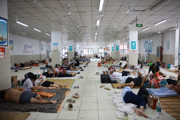 YUEQING, CHINA - AUGUST 09: Residents stay at a temporary relief shelter set up at Chengnan Middle School on August 9, 2026 in Yueqing, Wenzhou City, Zhejiang Province of China. China s national observatory on August 9 activated a red alert -- the highest level in the country s typhoon warning system -- as Typhoon Dolphin approaches.  Copyright: xChinaxNewsxServicex 111658969114