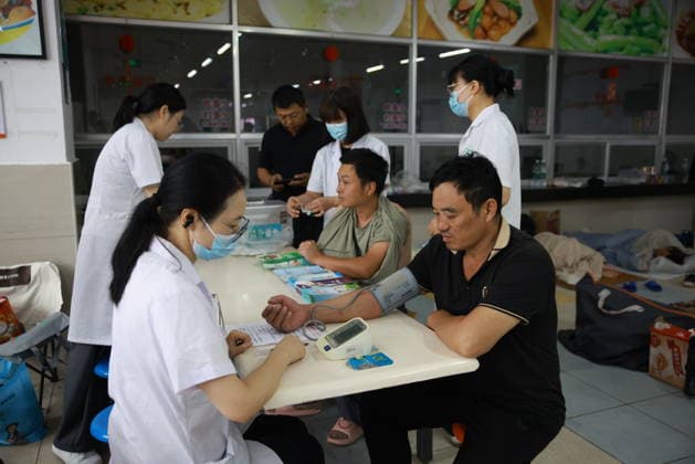 YUEQING, CHINA - AUGUST 09: A community doctor provides medical services at a temporary relief shelter set up at Chengnan Middle School on August 9, 2026 in Yueqing, Wenzhou City, Zhejiang Province of China. China s national observatory on August 9 activated a red alert -- the highest level in the country s typhoon warning system -- as Typhoon Dolphin approaches.  Copyright: xChinaxNewsxServicex 111658969207
