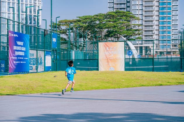 SHENZHEN, CHINA - AUGUST 08: A participant takes part in the Run, Teenagers 2026 Longgang District National Fitness Day themed event at Shenzhen Universiade Sports Centre on August 8, 2026 in Longgang District, Shenzhen City, Guangdong Province of China. The event marks the 18th National Fitness Day, featuring a morning run followed by water gun battles and a music party to promote public fitness.  Copyright: xVCGx 111659152150