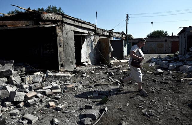 Russian drones strike garage cooperative in Zaporizhzhia Nataliia steps among the rubble at a garage cooperative damaged by a drone attack, Zaporizhzhia, Ukraine, on August 10, 2026. Forces launched strike drones on the southeastern Ukrainian city, hitting a garage cooperative. The attack sparked a fire and damaged buildings and vehicles. Zaporizhzhia Ukraine  Copyright: xDmytroxSmolienkox originalFilename: ukrinform-russiand260810_npjon.jpg