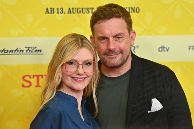 Sebastian BEZZEL, actor, with his wife Johanna Christine GEHLEN, actress, at the world premiere of *STECKERLFISCHFIASKO* on August 10, 20226, at the Mathaeser Kino in Munich. Red Carpet