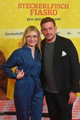 Sebastian BEZZEL, actor, with his wife Johanna Christine GEHLEN, actress, at the world premiere of *STECKERLFISCHFIASKO* on August 10, 20226, at the Mathaeser Kino in Munich. Red Carpet