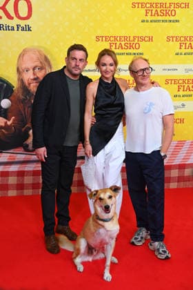 From left: Sebastian BEZZEL, actor; Lisa Maria POTTHOFF, actress; Simon Schwarz, actor. World premiere of *STECKERLFISCHFIASKO* on August 10, 20226, at the Mathaeser Kino in Munich. Red carpet.