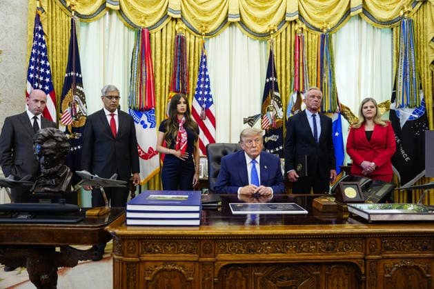 President Donald Trump (C) speaks after signing an executive order that reevaluates childhood vaccines in the Oval Office of the White House in Washington, DC on August 10, 2026. While the executive order still recommends childhood vaccines for 11 diseases, including measles and polio, it calls for limiting vaccines for other diseases, like hepatitis A and B and meningococcal disease, to high-risk populations.  WAP20260810117 BONNIExCASH