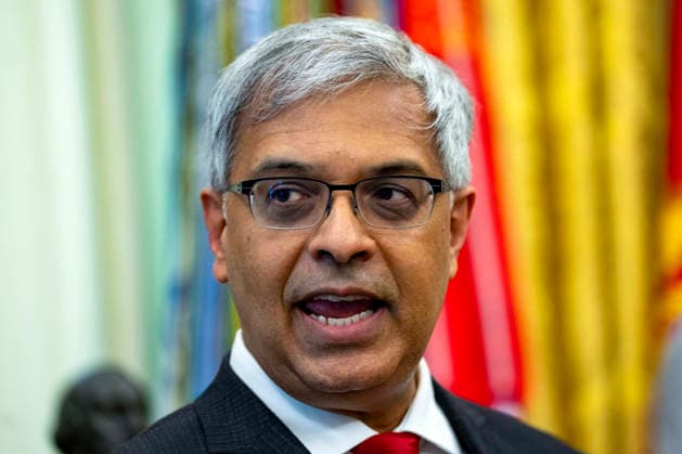 August 10, 2026, Washington, District Of Columbia, USA: Jayanta Bhattacharya, Director, National Institutes of Health (NIH) speaks before United States President Donald J Trump signs an executive order that reevaluates childhood vaccines in the Oval Office of the White House in Washington, DC, USA, on August 10, 2026. While the executive order still recommends childhood vaccines for 11 diseases, including measles and polio, it calls for limiting vaccines for other diseases, like hepatitis A and B and meningococcal disease, to high-risk populations Washington USA  - ZUMAs152 20260810_faa_s152_007 Copyright: xBonniexCashx-xPoolxviaxCNPx