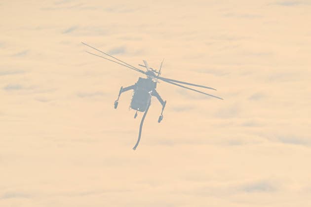 California s Timber Fire of wildfire in Big Sur BIG SUR, CALIFORNIA - AUG 10: A fire helicopter in operational as Timber Fire of wildfire continues in Big Sur of California, United States on August 10, 2026. Tayfun Coskun Anadolu California United States. Editorial use only. Please get in touch for any other usage.  Copyright: x2026xAnadoluxTayfunxCoskunx