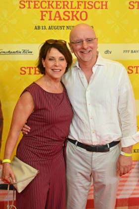 Janina HARTWIG, actress, with her partner Alexander PUTZ, mayor of Landshut; world premiere of *STECKERLFISCHFIASKO* on August 10, 20226, at the Mathaeser Kino in Munich; red carpet