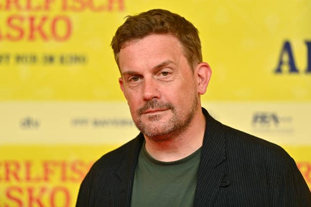 Sebastian BEZZEL, actor; still image, cropped single shot, portrait; World Premiere of *STECKERLFISCHFIASKO* on August 10, 20226, at the Mathäuser Kino in Munich; Red Carpet