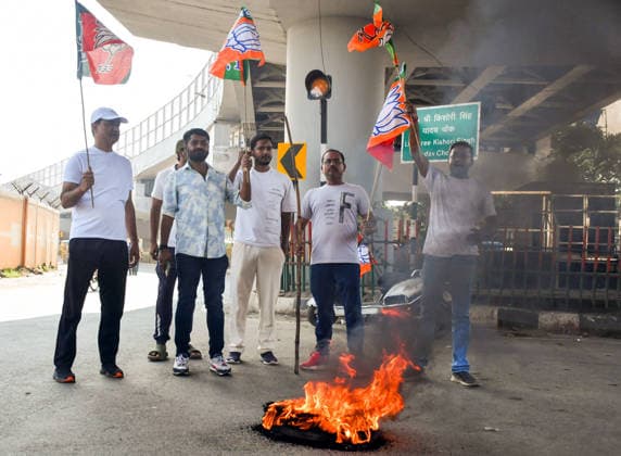 Protest Over Irregularities in the Recruitment Examinations in Ranchi Ranchi, Aug 11 (ANI): BJP workers raise slogans in front of a burning tyre during the statewide Jharkhand Bandh , called by BJP workers over alleged irregularities in recruitment examinations, in Ranchi on Tuesday. Ranchi Jharkhand India Copyright: xANIx ANI_20260811056