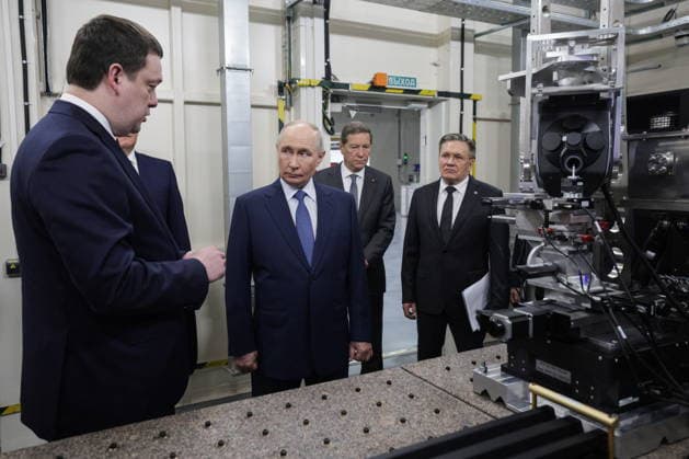 RUSSIA, NOVOSIBIRSK - AUGUST 11, 2026: Russia s President Vladimir Putin (C) visits Shared Research Facility of the Siberian Ring Source of Photons (SKIF). Pictured R-L: Alexei Likhachev, Director General of the Rosatom State Atomic Energy Corporation, and Russian State Duma s First Deputy Speaker Alexander Zhukov. Gavriil Grigorov Russian Presidential Press and Information Office TASS  96026813