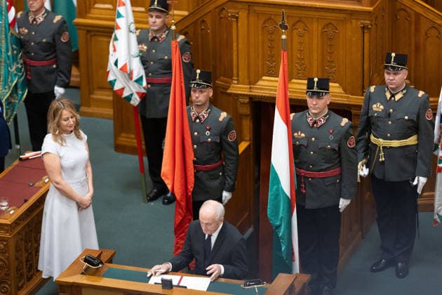 (260811) -- BUDAPEST, Aug. 11, 2026 -- Andras Baka (front), Hungary s newly elected president, signs the inauguration document at the parliament in Budapest, Hungary, Aug. 11, 2026. Hungary s parliament on Tuesday elected former Supreme Court chief Andras Baka as the country s new president. (Photo by Xinhua) HUNGARY-BUDAPEST-ANDRAS BAKA-NEW PRESIDENT PeterxZsolnai 