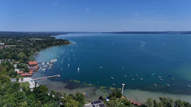 A summer day in Dießen on Lake Ammersee, Landsberg am Lech District. Here is a view of the town from above: townscape, village view, skyline, view of houses, lakeshore of Lake Ammersee, looking north.