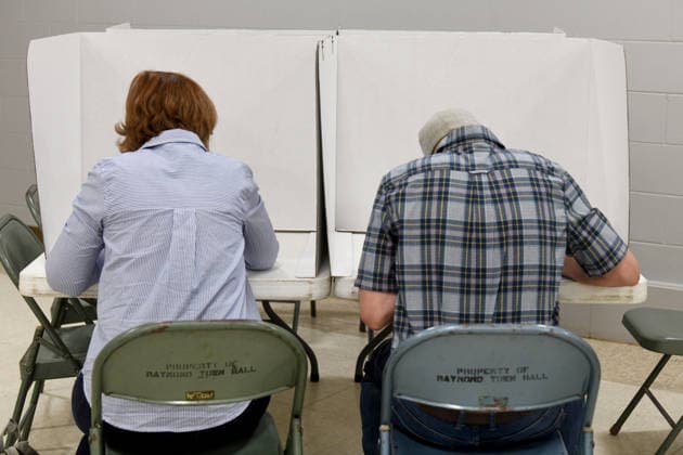 August 11, 2026, Raymond, Wisconsin, USA: MITCHELL BERMAN, right, votes with his wife JILL BERMAN Tuesday August 11, 2026 at the Village of Raymond Town Hall in his three-way Democratic primary race hoping to unseat Republican incumbent Bryan Steil who represents the First Congressional District, including Racine County. Raymond USA - ZUMAh154 20260811_znp_h154_019 Copyright: xMarkxHertzbergx