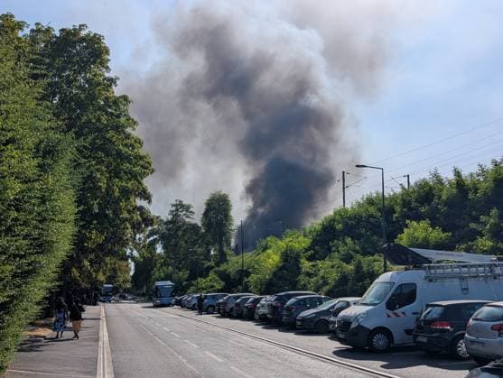 Major fire broke near Roissy-CDG Airport in Paris PARIS, FRANCE - AUGUST 11: A view of smoke after a fire broke in Louvres, near Roissy-CDG Airport, north of Paris, France on August 11, 2026. The fire led to the temporary closure of two of the airport’s runways. Rail and road traffic was partially disrupted. In total, nearly 110 firefighters were deployed and, according to initial reports, at least several dozen vehicles were destroyed by the flames. Luc Auffret Anadolu Paris France. Editorial use only. Please get in touch for any other usage.  Copyright: x2026xAnadoluxLucxAuffretx