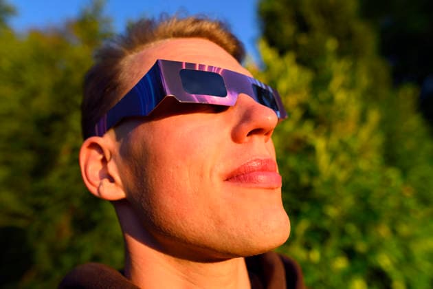 Young man wearing protective glasses for the solar eclipse in Hamburg, Germany Hamburg Hamburg Germany ** FOR EDITORIAL PURPOSES ONLY ** EDITORIAL USE ONLY **