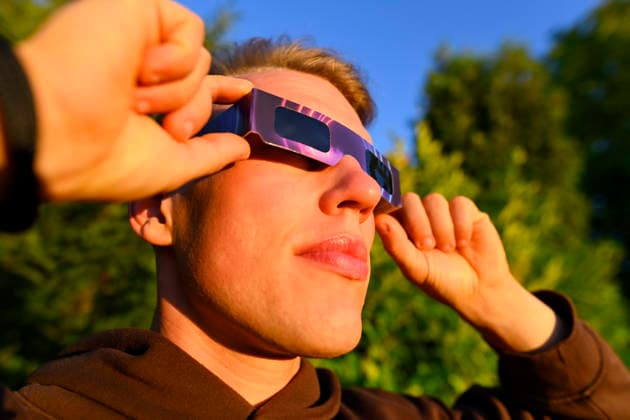 Young man wearing protective glasses for the solar eclipse in Hamburg, Germany Hamburg Hamburg Germany ** FOR EDITORIAL PURPOSES ONLY ** EDITORIAL USE ONLY **
