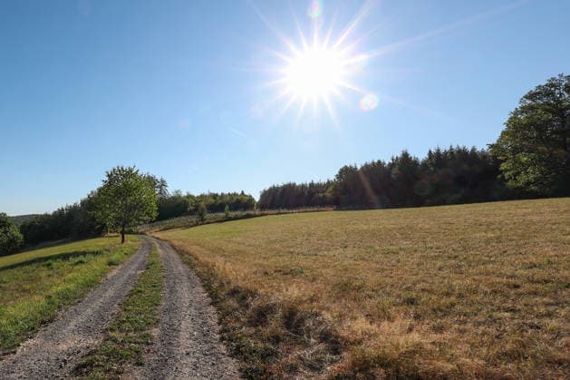 Summer in the Siegerland: A wonderful summer morning with plenty of sunshine. Temperatures are expected to rise again over the next few days. The sky is blue, and the sun is shining down on the landscape. Summer on August 12, 2026, in Siegen, Germany