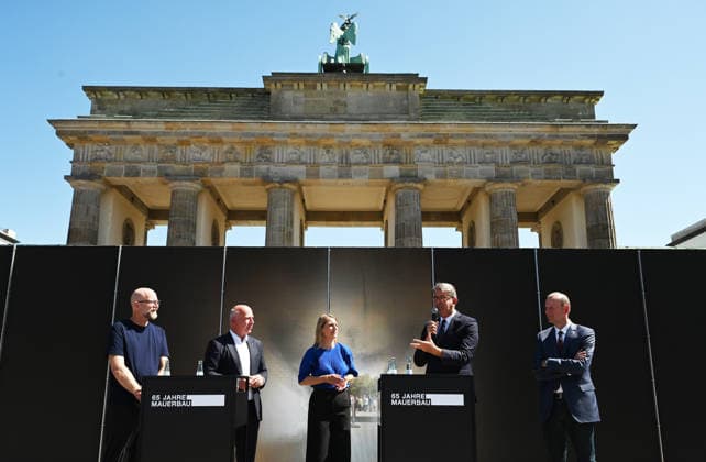 65th Anniversary of the Berlin Wall in Berlin BERLIN, GERMANY – AUGUST 12: Berlin’s Governing Mayor Kai Wegner and Federal Commissioner for Culture and the Media Wolfram Weimer attend the opening ceremony of a 30-meter-long temporary memorial installation and the open-air exhibition Views of the Wall: Berlin 1961–1990, marking the 65th anniversary of the construction of the Berlin Wall, near the Brandenburg Gate in Berlin, Germany, on August 12, 2026. Volodymyr Sindieiev Anadolu Berlin Germany. Editorial use only. Please get in touch for any other usage.  Copyright: x2026xAnadoluxVolodymyrxSindieievx