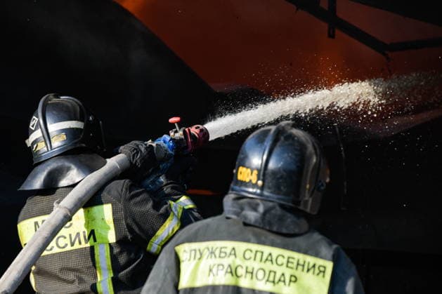 RUSSIA, KRASNODAR REGION - AUGUST 12, 2026: Employees of the Russian Emergencies Minsitry respond to a fire at a warehouse storing plastic products in the village of Lenina, southeast of Krasnodar. The fire covering an area of 2.2 thousand sq m has been contained. Roman Sokolov TASS  96070286