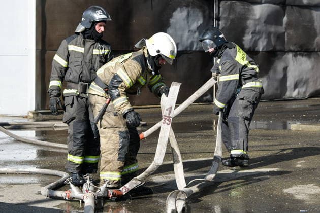 RUSSIA, KRASNODAR REGION - AUGUST 12, 2026: Employees of the Russian Emergencies Minsitry respond to a fire at a warehouse storing plastic products in the village of Lenina, southeast of Krasnodar. The fire covering an area of 2.2 thousand sq m has been contained. Roman Sokolov TASS  96070024
