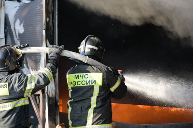 RUSSIA, KRASNODAR REGION - AUGUST 12, 2026: Employees of the Russian Emergencies Minsitry respond to a fire at a warehouse storing plastic products in the village of Lenina, southeast of Krasnodar. The fire covering an area of 2.2 thousand sq m has been contained. Roman Sokolov TASS  96070283