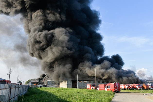 RUSSIA, KRASNODAR REGION - AUGUST 12, 2026: Smoke billows over a warehouse storing plastic products, hit by fire in the village of Lenina, southeast of Krasnodar. The fire covering an area of 2.2 thousand sq m has been contained. Roman Sokolov TASS  96070275