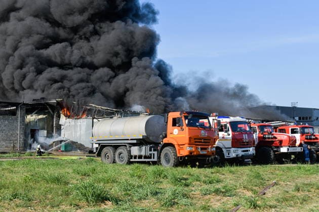 RUSSIA, KRASNODAR REGION - AUGUST 12, 2026: Smoke billows over a warehouse storing plastic products, hit by fire in the village of Lenina, southeast of Krasnodar. The fire covering an area of 2.2 thousand sq m has been contained Russia  - ZUMAt113 20260812_zaa_t113_379 Copyright: xRomanxSokolovx