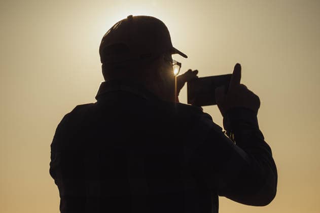 Solar eclipse viewed from Slovakia KOJSOV, SLOVAKIA - AUGUST 12: A man takes photographs of the Sun during a total eclipse of the sun on August 12, 2026 near Kojsov, Slovakia. Millions of people have flocked to areas where the eclipse was visible. During the event, the moon passed in between the Sun and the Earth, appearing to partially block the sun. Robert Nemeti Anadolu Kojsov Slovakia. Editorial use only. Please get in touch for any other usage.  Copyright: x2026xAnadoluxRobertxNemetix