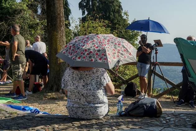 August 12, 2026, Torino, Italy: TURIN, ITALY Ã¢â‚¬ AUGUST 12, 2026: Hundreds of people gather in front of the Basilica of Superga, one of Turin s highest viewpoints, to observe a partial solar eclipse at sunset on August 12, 2026. Spectators used eclipse glasses and other viewing devices as the Moon obscured most of the solar disc, with the phenomenon reaching its maximum visible phase in the Turin area at around 8:30 p.m. Torino Italy - ZUMAq101 20260812_zna_q101_222 Copyright: xChiaraxAntenuccix