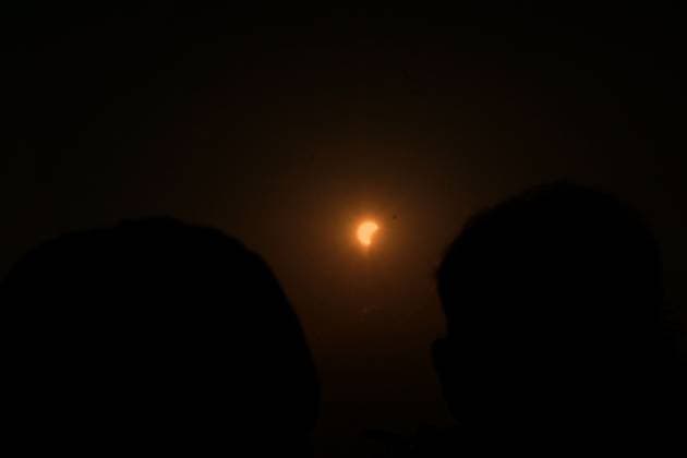 August 12, 2026, Torino, Italy: TURIN, ITALY Ã¢â‚¬ AUGUST 12, 2026: Hundreds of people gather in front of the Basilica of Superga, one of Turin s highest viewpoints, to observe a partial solar eclipse at sunset on August 12, 2026. Spectators used eclipse glasses and other viewing devices as the Moon obscured most of the solar disc, with the phenomenon reaching its maximum visible phase in the Turin area at around 8:30 p.m. Torino Italy - ZUMAq101 20260812_zna_q101_234 Copyright: xChiaraxAntenuccix