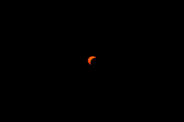Solar Eclipse over Mount Nerone A solar eclipse photographed from Top of Mount Nerone, at 1,550 metres above sea level in the Tusco-Romagnolo Apennines, Italy. From this latitude, the eclipse was visible only as a partial eclipse. Italy Copyright: xAndreaxCalandrax
