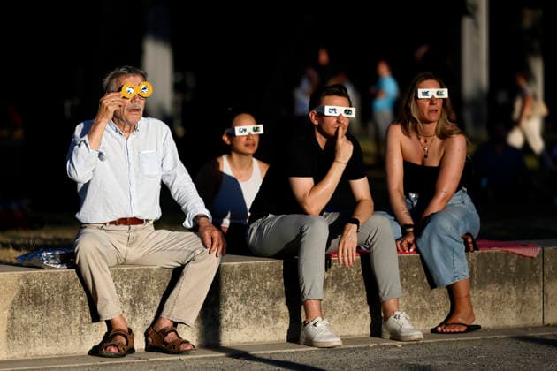 Numerous onlookers, many of them wearing special glasses, watch in the evening hours the sky over Cologne briefly darken. The Moon moves between the Earth and the Sun, casting its shadow onto the Earth and visually obscuring the Sun. The partial solar eclipse will reach its maximum visibility o Copyright: xChristophxHardtx