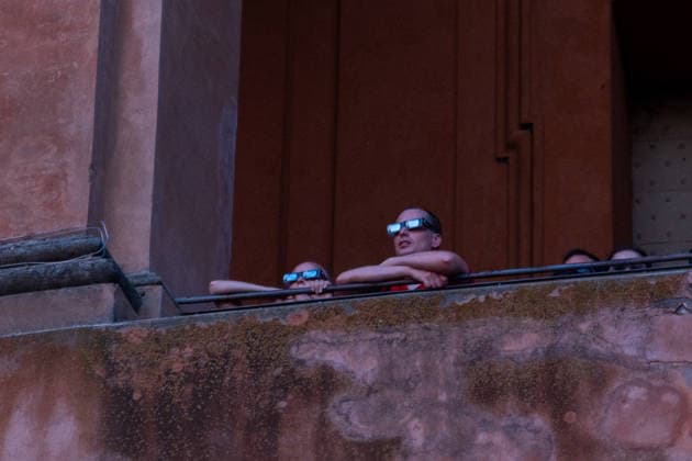IPA87432112 - Spectators wear protective eclipse glasses to safely watch a solar eclipse at the Sanctuary of the Madonna di San Luca. Bologna, Italy, August 8, 2026  Copyright: xLeonardoxGaravaglia LiveMediax xx 87432112
