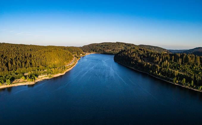 View of Schluchsee in the evening sun; Schluchsee, Germany, July 12, 2026. An aerial view taken from a drone shows Schluchsee in the Black Forest during the golden hour. The calm water is surrounded by dense coniferous forests. Copyright: xAndreasxHaasx
