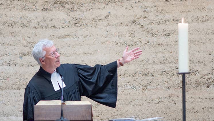 Thomas Jeutner, pastor at the Chapel of Reconciliation, during his welcoming remarks at the 65th anniversary commemoration of the construction of the Berlin Wall on August 13, 2026, at the Chapel of Reconciliation, Berlin Wall Memorial, Berlin, Germany; Berlin Wall Memorial, Ka