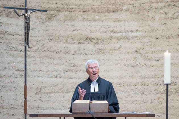 Thomas Jeutner, pastor at the Chapel of Reconciliation, during his welcoming remarks at the 65th anniversary commemoration of the construction of the Berlin Wall on August 13, 2026, at the Chapel of Reconciliation, Berlin Wall Memorial, Berlin, Germany; Berlin Wall Memorial, Ka