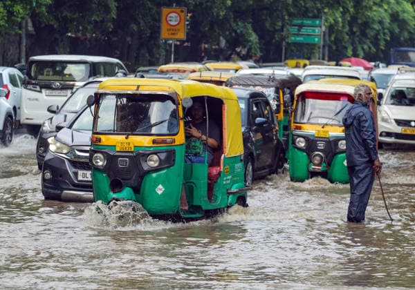 RECORD DATE NOT STATED Heavy rain lashes parts of the National Capital New Delhi, Aug 13 (ANI): Commuters wade through a waterlogged San Martin Marg following heavy rainfall, in New Delhi on Thursday. New Delhi Delhi India Copyright: xANIx ANI_20260813529