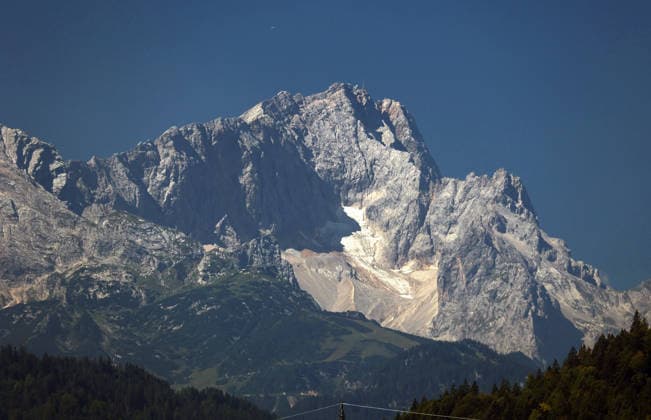A summer day near Krün, Oberland, Werdenfelser Land, Garmisch-Partenkirchen District. Here is a view of the Wetterstein Massif with the Zugspitze, rocky peaks, and alpine scenery.