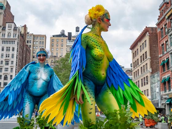 August 13, 2026, New York, New York, USA: NYC PETA demonstration in Union Square with painted live parakeet models on stilts bringing attention to a PETA investigation exposing a mass breeding factory in Petco s supply chain. They are claiming birds are crammed tightly into waste filled cages without veterinary care for sick or injured animals and left to die. The animal rights group charges an Oklahoma breeder Creekside birds with animal cruelty and ask please dont buy birds or any other live animals from Petco or any other pet store. Adopt instead. New York USA  - ZUMAh156 20260813_znp_h156_002 Copyright: xMiloxHessx