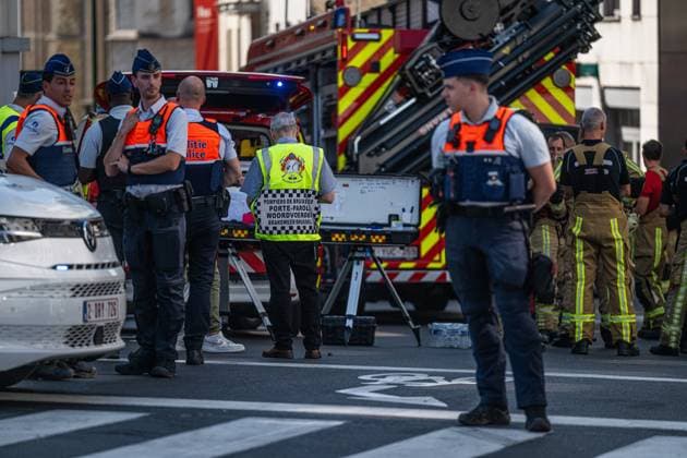 Emergency services pictured on the site of an explosion at the Treurenberg in the city center of Brussels, Friday 14 August 2026. According to the first information, two explosion happened in a building which was evacuated earlier in the day after a gas leak was detected, injuring two people.  EMILExWINDAL 1081058043st