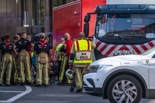 Emergency services pictured on the site of an explosion at the Treurenberg in the city center of Brussels, Friday 14 August 2026. According to the first information, two explosion happened in a building which was evacuated earlier in the day after a gas leak was detected, injuring two people.  EMILExWINDAL 1081058056st