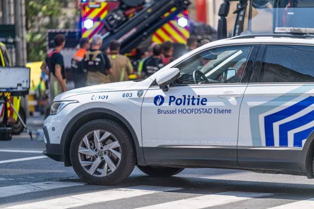 Emergency services pictured on the site of an explosion at the Treurenberg in the city center of Brussels, Friday 14 August 2026. According to the first information, two explosion happened in a building which was evacuated earlier in the day after a gas leak was detected, injuring two people.  EMILExWINDAL 1081058061st